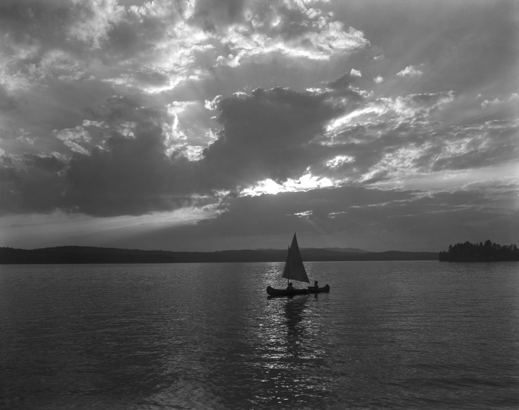 Miniature of Canoe With A Sail On Long Lake In Naples, Nice Clouds In Sky, Mountains In Distance