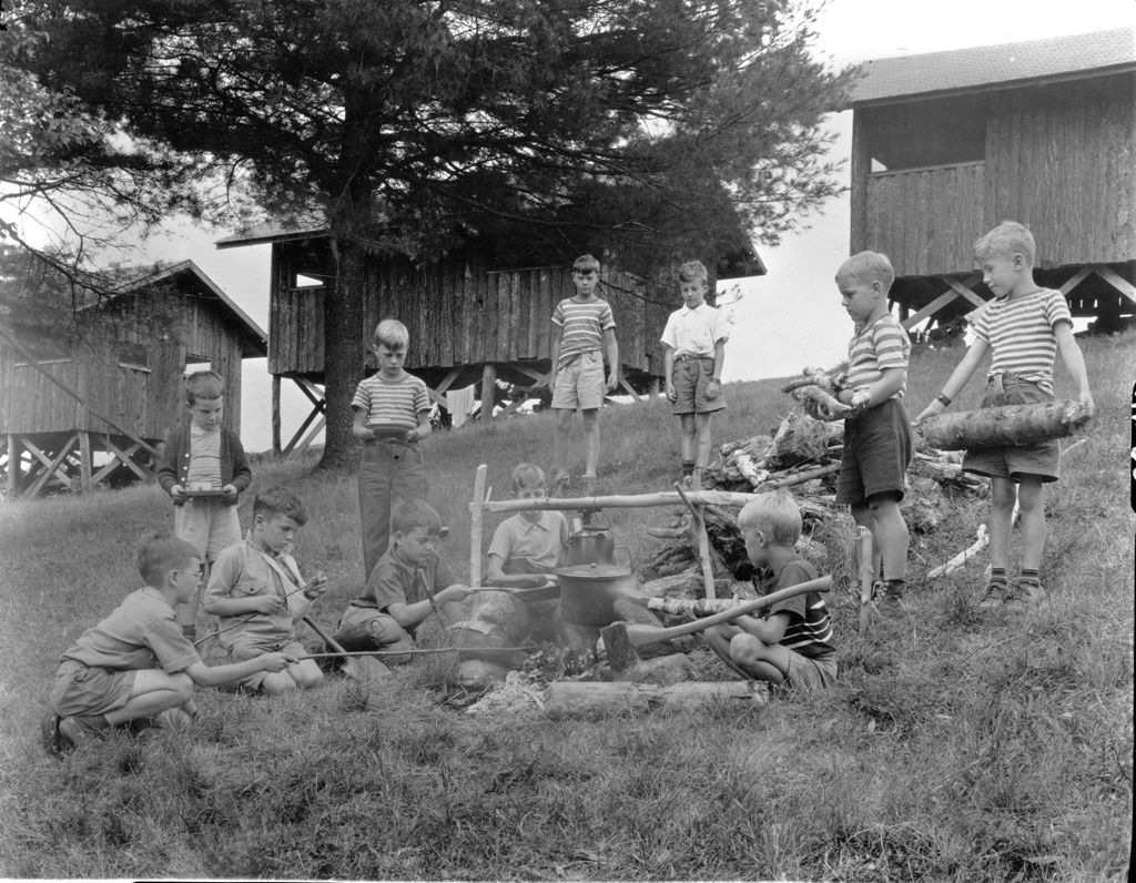 Miniature of Young Boy Campers Cooking By A Campfire
