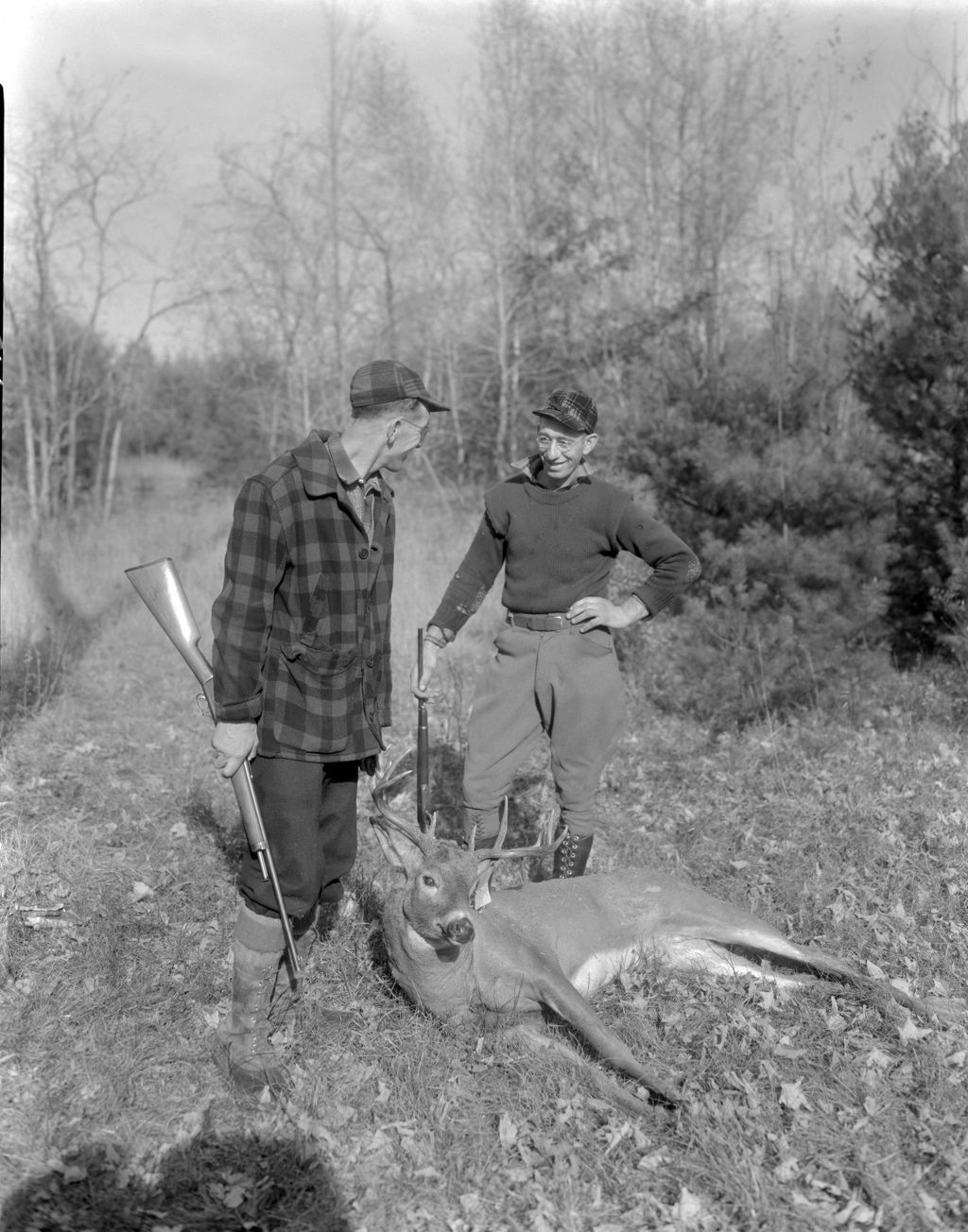 Miniature of Two Hunters Standing Near A Ten Point Buck They Shot In Standish
