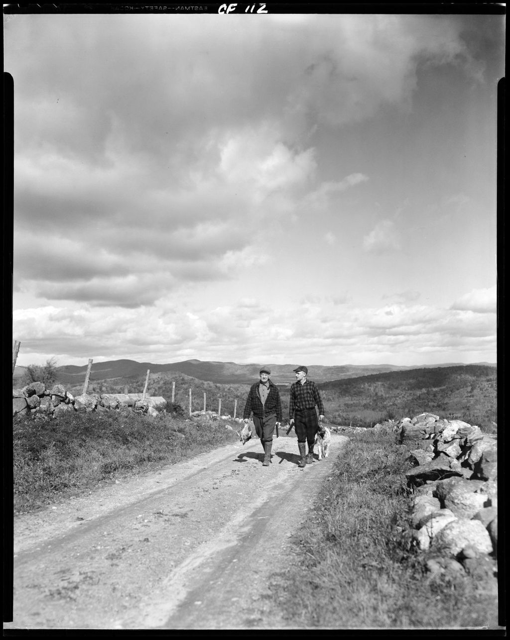 Miniature of Two Partridge Hunters And A Dog Walking Down A Road, Mountains In Background In Cornish