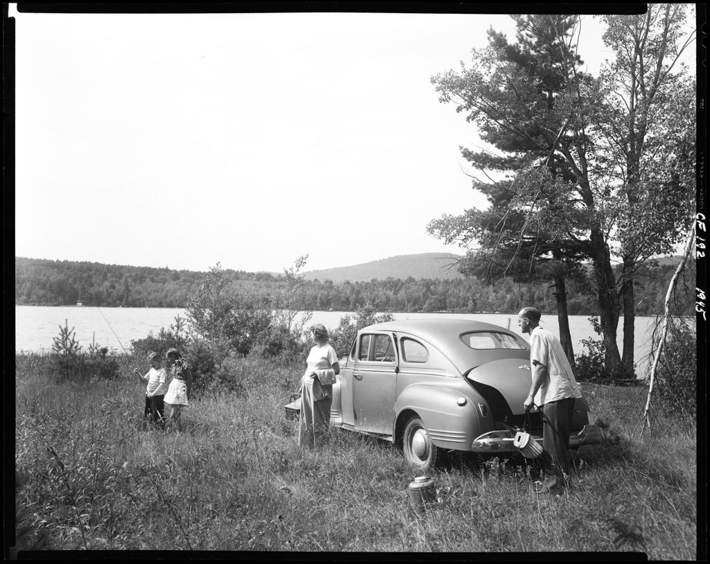 Miniature of Family Getting Set Up For A Picnic Lunch Near A Lake In Porter