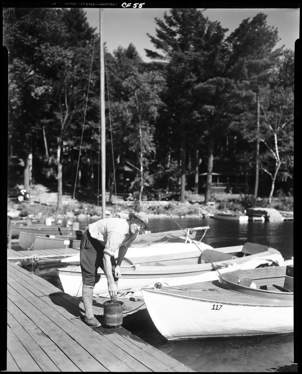 Miniature of Sailboats Tied Up At Dock, Man Pick Up Bait Can On Kezar Lake