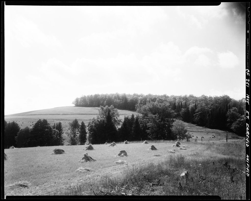 Miniature of Hay Stacks Drying Under A Cloudy Sky In Fort Fairfield
