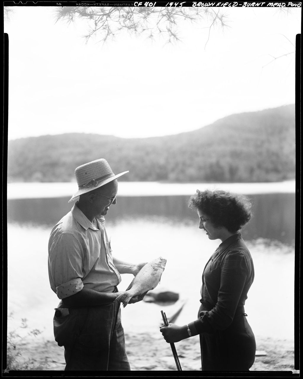 Miniature of Old Timer Discussing Fish He Caught With A Young Lady In Parsonsfield