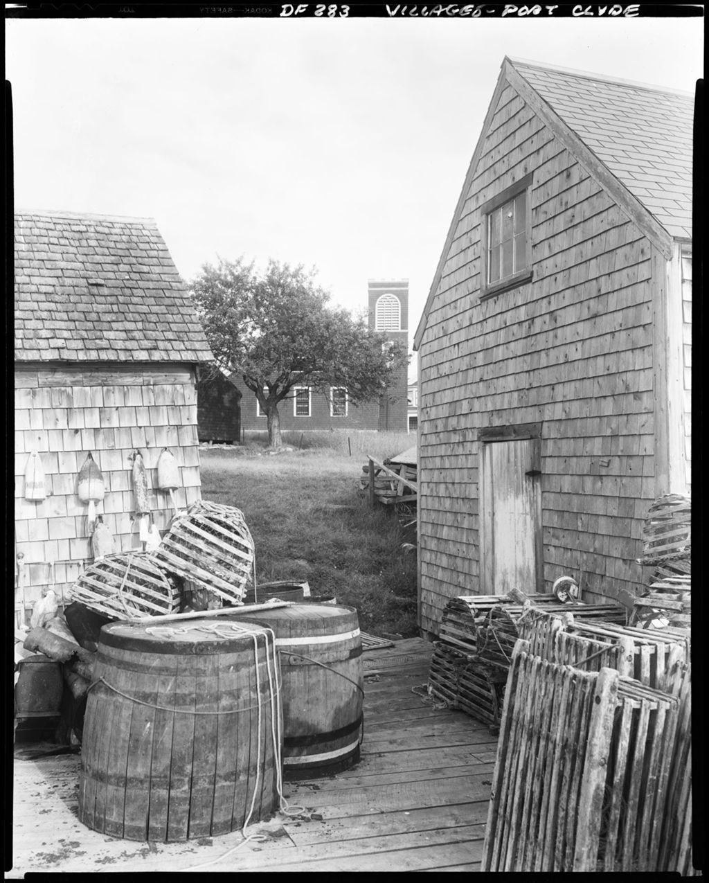Miniature of Church Framed By Lobster Traps And Fishermen's Shops In Port Clyde