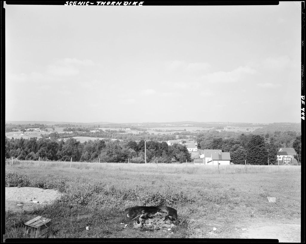 Miniature of Looking Down A Hill Seeing The Roof Tops Of Houses In Thorndike And Distant Mountains