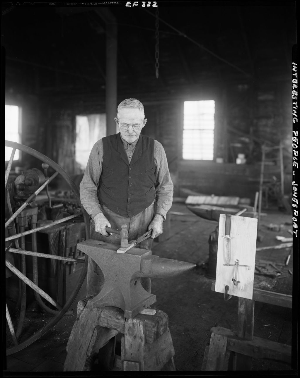 Miniature of A Blacksmith In Jonesport Working A Piece Of Hot Metal On An Anvil