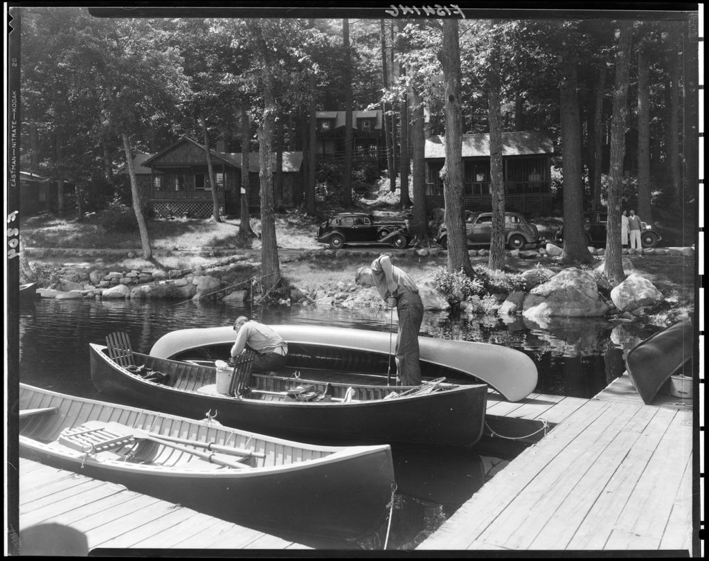 Miniature of Two Men On A Dock Getting Ready To Go Out Fishing