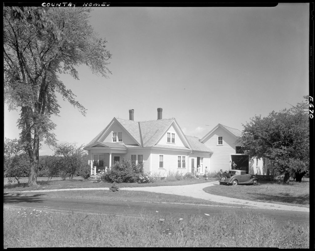 Miniature of Shot Of Lovely Home With People Walking To Door From Driveway, Old Convertible With Rumble Seat Parked Outside