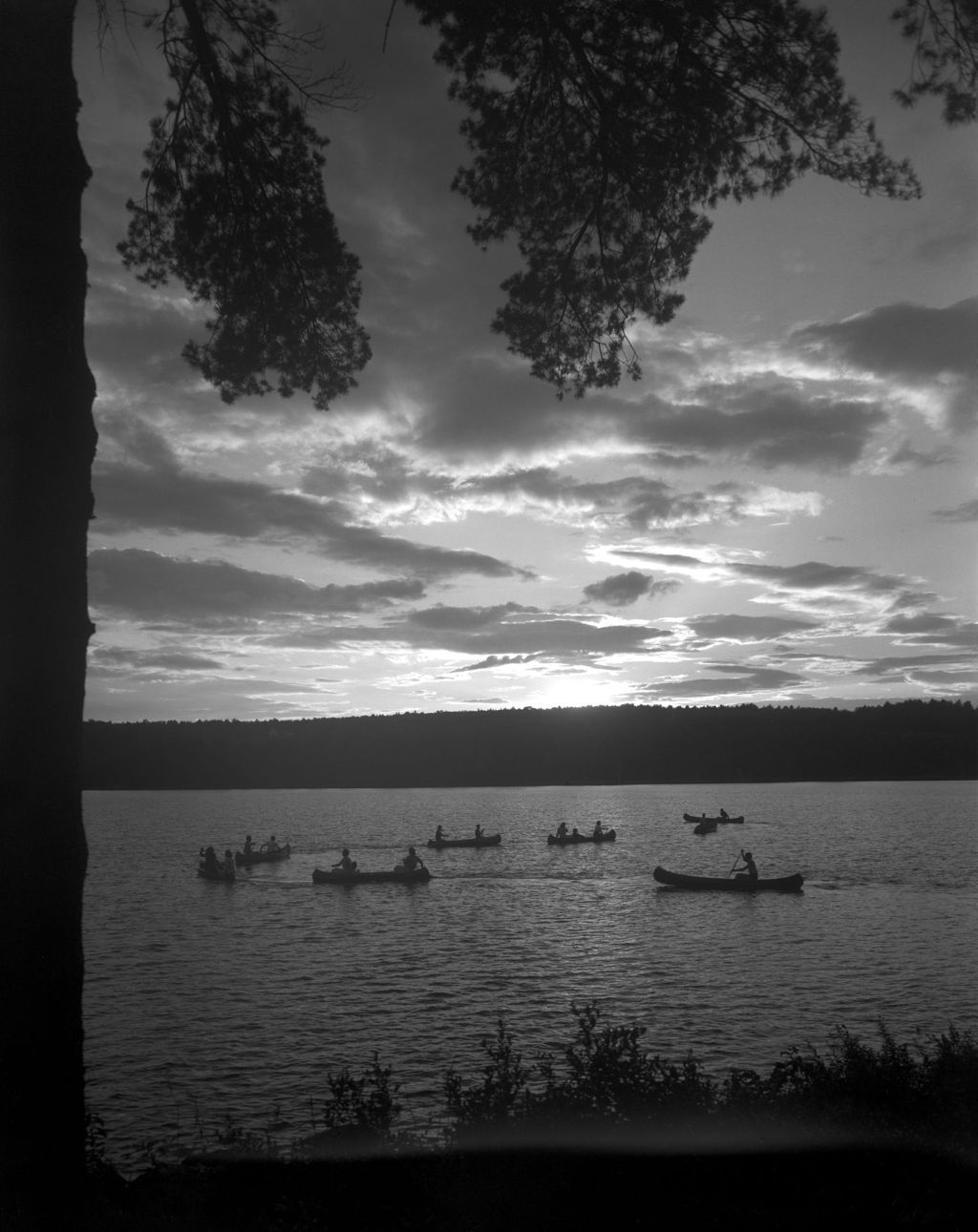Miniature of A Group Of Canoeists On A Lake At Sunset