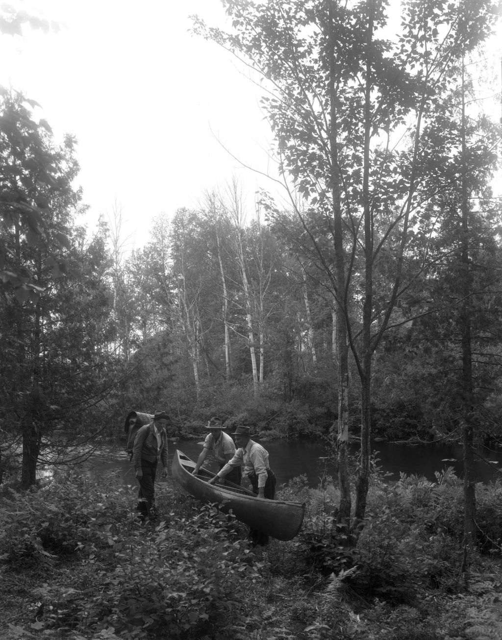 Miniature of Three Men Getting Ready To Launch A Canoe In Rangeley