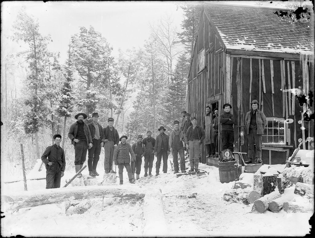 Miniature of Winter scene of men outside a logging camp building