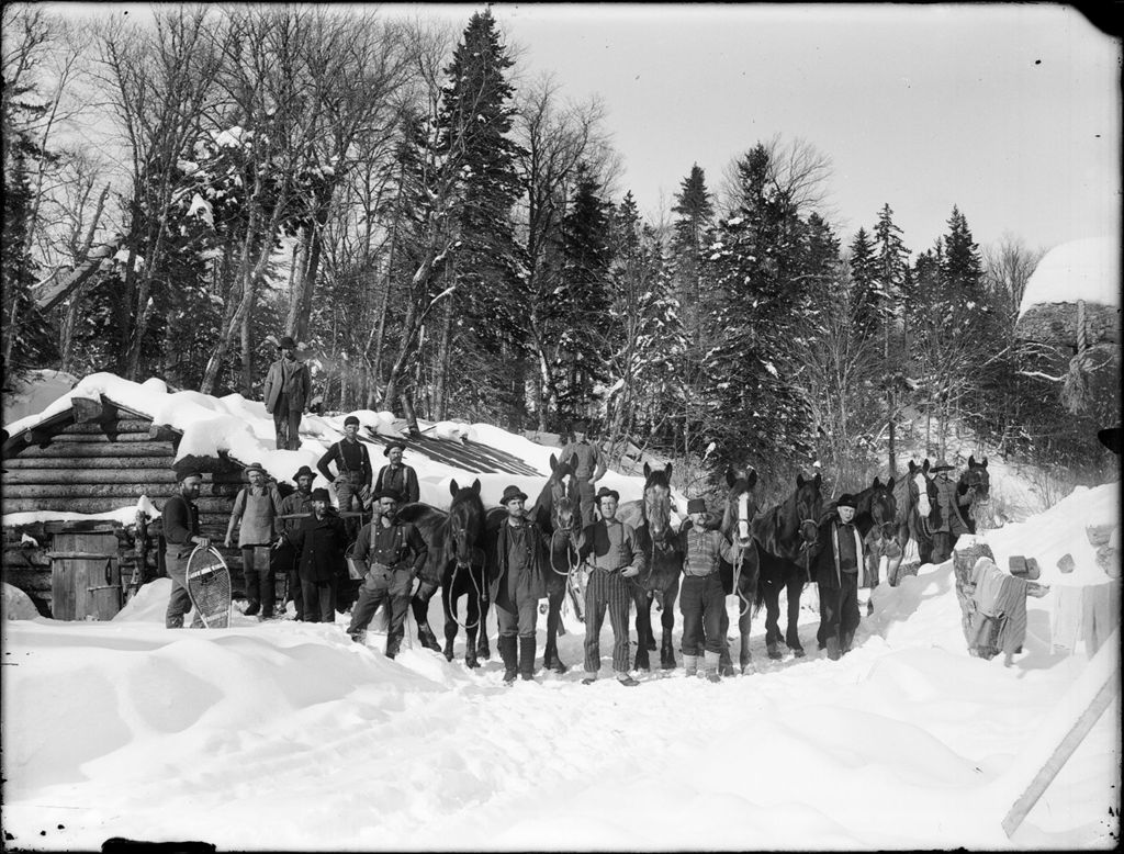 Miniature of Snow covered winter scene of men and horses at a logging camp