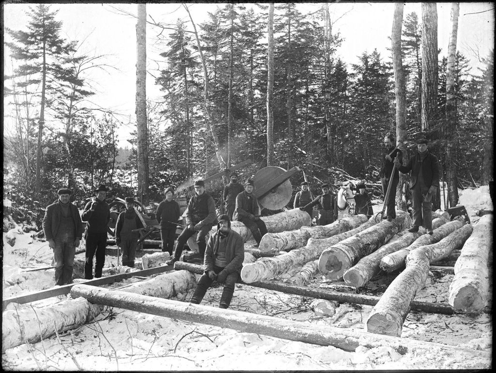 Miniature of Winter woodland scene of a group of men from a logging camp with cut logs and a circular chop saw