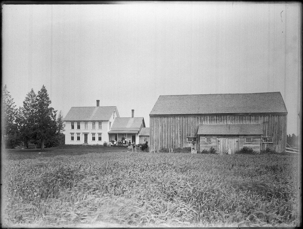 Miniature of Family posed on the porch of their rural house with attached barn, field in foreground