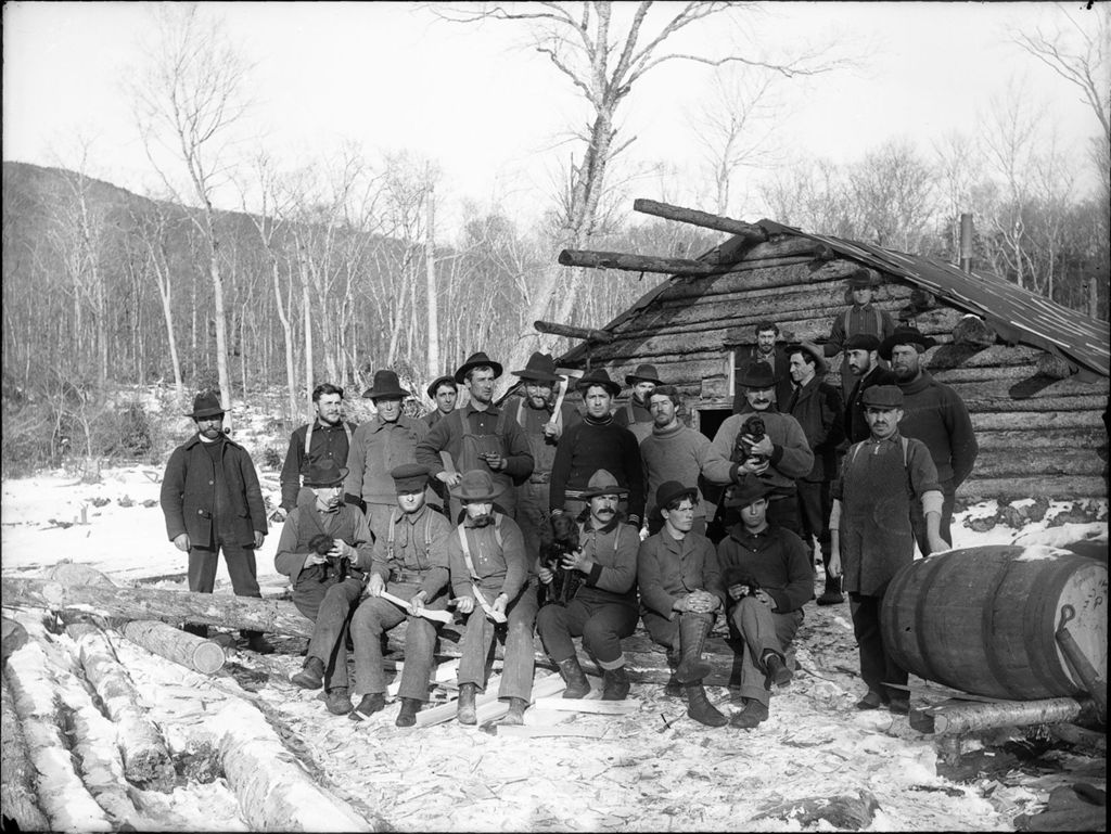 Miniature of Winter scene of many men outside a log cabin camp
